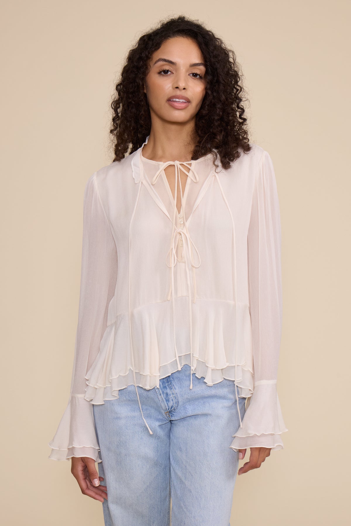 Donna LS Peplum Top